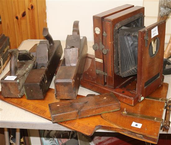 Four wooden planes, a rudder and a plate camera